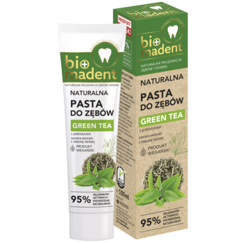 Naturalna pasta do zębów Bio Madent Green Tea w zielono-białej tubce i pudełku z liśćmi herbaty, widok z przodu.