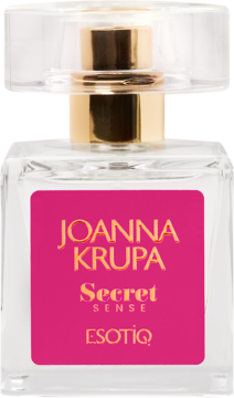 Perfumy Joanna Krupa Secret Sense w przezroczystej butelce z różową etykietą i złotymi napisami, widok z przodu.