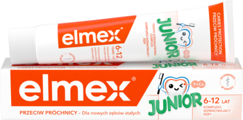 Elmex Junior 6-12 lat pasta do zębów przeciw próchnicy, czerwono-biała tubka leży na pudełku z zębem.
