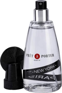 Damska woda toaletowa Pret-a-Porter Coty w przezroczystej butelce z czarną etykietą, obok leży nakrętka.