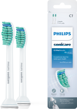 Dwie białe końcówki Philips Sonicare ProResults C1 z zielono-niebieskim włosiem, obok opakowania.