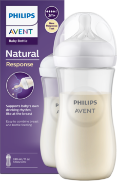 Philips Avent Natural Response butelka dla niemowląt, biała, z mlekiem, na fioletowym tle opakowania.