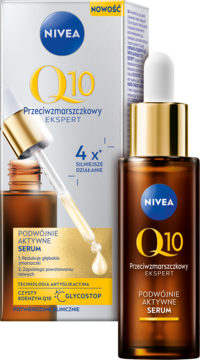 NIVEA Q10 Podwójnie Aktywne Serum w brązowej butelce z pipetą, obok biało-złote opakowanie produktu.