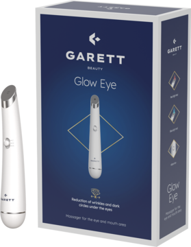Biały masażer Garret Beauty Glow Eye i ciemnoniebieskie pudełko z grafiką i napisem o redukcji zmarszczek.