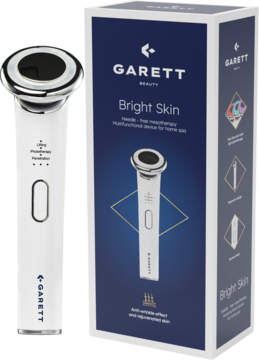 Białe urządzenie Garett Beauty Bright Skin do mezoterapii bezigłowej z metalową głowicą obok niebieskiego opakowania.
