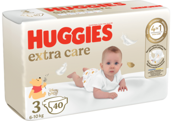 Huggies Extra Care pieluchy rozmiar 3 (6-10 kg) w beżowym opakowaniu z wizerunkiem bobasa i Kubusia Puchatka. Widok z przodu.