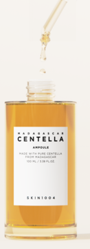 Skin1004 Madagascar Centella Ampoule, bursztynowy płyn w szklanej butelce, krople z pipety.