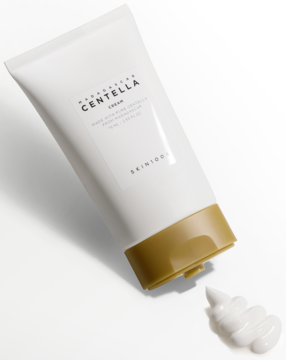 SKIN1004 Madagascar Centella Cream w białej tubce ze złotą zakrętką, wyciśniętym kremem, leżąca pod kątem.