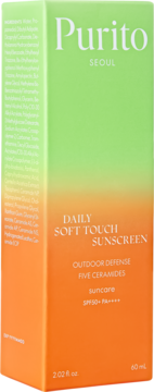 Krem przeciwsłoneczny Purito Daily Soft Touch Sunscreen SPF50+ w zielono-pomarańczowym pudełku.