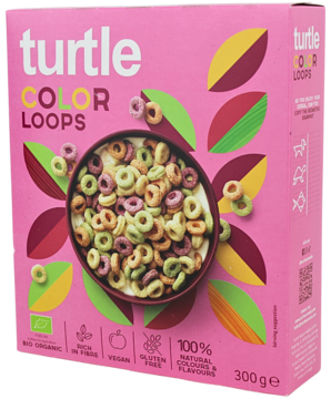 Różowe pudełko płatków śniadaniowych Turtle Color Loops z miską kolorowych krążków zbożowych, widok z przodu.