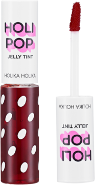 Holika Holika Holi Pop Jelly Tint, czerwony błyszczyk w butelce z białymi kropkami i otwarty aplikator obok.