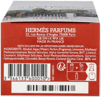 Tył czerwono-pomarańczowego pudełka Hermes Un Jardin Sur La Lagune EDT ze składnikami i kodem.