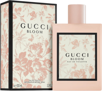 Flakon Gucci Bloom EDT w jasnoróżowym kolorze z kwiatowym wzorem, obok pasujące pudełko. Widok z przodu.