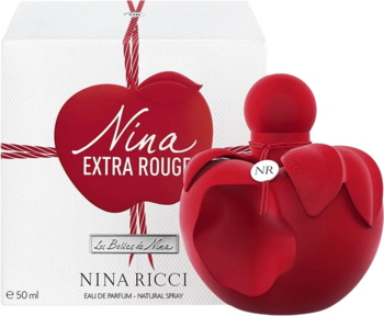 Czerwony, matowy flakon perfum Nina Ricci Nina Extra Rouge w kształcie jabłka obok białego pudełka.
