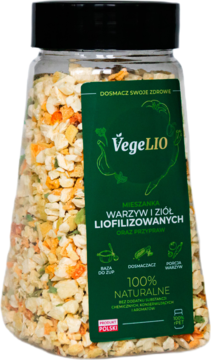 Butelka VegeLIO z liofilizowaną mieszanką warzyw i ziół, zielona etykieta, widoczne kolorowe kawałki, widok z przodu.