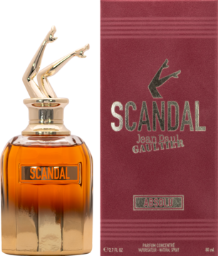 Perfumy Scandal Jean Paul Gaultier: bursztynowa butelka ze złotą nakrętką w kształcie nóg, obok czerwone pudełko.