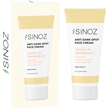 Sinoz Anti Dark Spot Face Cream, jasnożółta tubka z białym korkiem, widok z przodu, z witaminą C i niacynamidem, obok fragment opakowania.
