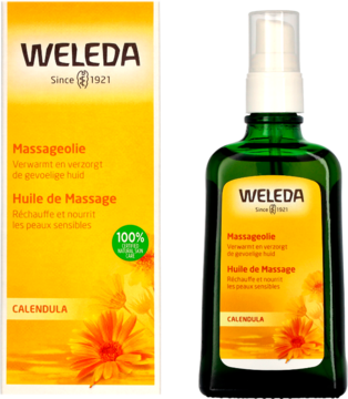 Weleda Calendula Massage Oil w ciemnozielonej butelce z rozpylaczem, obok żółte opakowanie produktu.