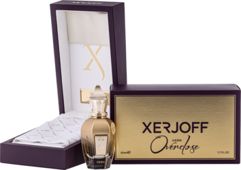 Xerjoff Uden Overdose, złoty flakon perfum unisex obok otwartego purpurowego pudełka i drugiego opakowania.