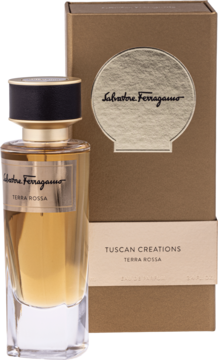 Woda perfumowana Salvatore Ferragamo Tuscan Creations Terra Rossa w bursztynowym flakonie obok złotego pudełka.