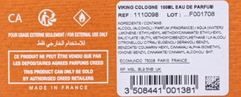 Tył pomarańczowego opakowania Creed Viking Cologne 100ml EDP z białą etykietą, widoczne składniki, ostrzeżenia, kod kreskowy.