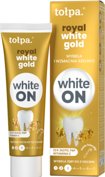 Złota tuba i pudełko pasty Tołpa Royal White Gold wybielającej zęby, widoczne z przodu obok siebie.