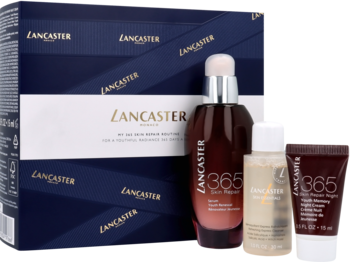 Zestaw kosmetyków Lancaster 365 Skin Repair: serum, płyn, krem, obok granatowego pudełka prezentowego.