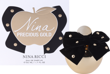 Złota butelka perfum Nina Ricci Nina Precious Gold z czarną kokardą, widok z przodu obok opakowania z jabłkiem.