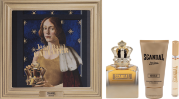 Zestaw Jean Paul Gaultier Scandal Absolu dla mężczyzn: perfumy, miniatura, żel pod prysznic, obok obraz w złotej ramie.