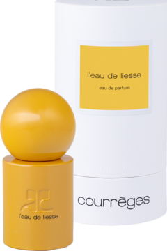 Żółta woda perfumowana Courrèges L'Eau De Liesse w butelce z kulistą górą, obok białe cylindryczne opakowanie, widok z przodu.