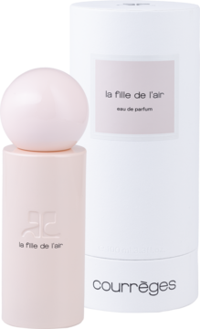 Courrèges La Fille de L'Air woda perfumowana unisex. Jasnoróżowa butelka z logo obok białego cylindrycznego pudełka.