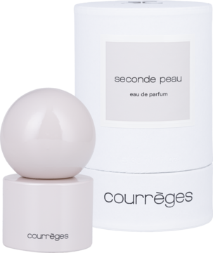 Courrèges Seconde Peau, jasnoróżowa kulista butelka unisex EDP i białe pudełko z nutami herbaty i sosny, z przodu.