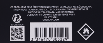 Tył opakowania perfum Guerlain L’Homme Ideal z kodem kreskowym, QR, informacjami o marce i symbolem łatwopalności.