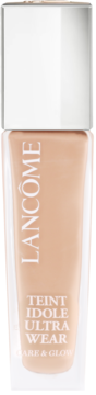 Jasnobeżowy podkład Lancôme Teint Idole Ultra Wear Care & Glow w szklanej butelce z białą nakrętką.