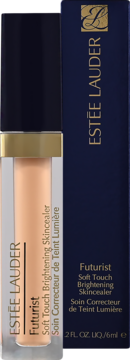 Pionowo ustawiony korektor Estée Lauder Futurist w beżowej tubce, obok granatowego pudełka.