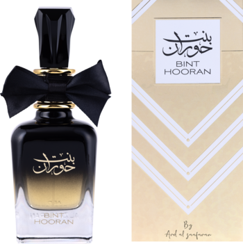 Damska woda perfumowana Ard Al Zaafaran Bint Hooran, elegancki czarno-złoty flakon obok beżowego pudełka z logo.