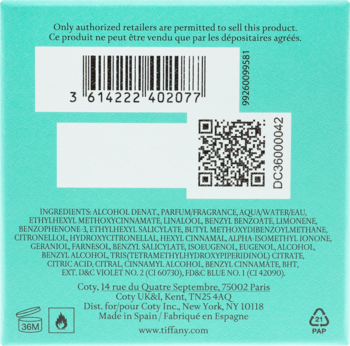 Tył tealowego opakowania perfum Tiffany & Co. z kodem kreskowym, QR, listą składników i danymi Coty.