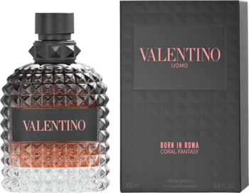 Valentino Born In Roma Coral Fantasy EDT, butelka z koralowym płynem obok czarnego pudełka, tekstura.