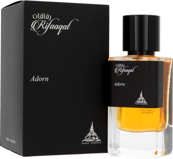 Woda perfumowana Paris Corner Rifaaqat Adorn w bursztynowej butelce i czarnym pudełku z napisami, ujęcie z przodu, obok siebie.