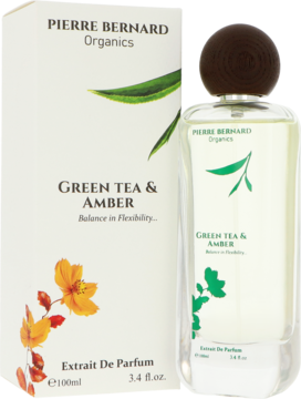 Pierre Bernard Green Tea & Amber unisex Extrait De Parfum w butelce obok białego pudełka z zielonym liściem.