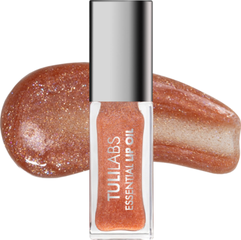 Tuli Labs Essential Lip Oil Amber Sparkle. Brokatowy olejek do ust w buteleczce, z iskrzącym rozmazem na tle.