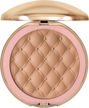 Bronzer prasowany Glamour Brazil, złoto-różowe otwarte opakowanie z lusterkiem, brązowy puder z pikowanym wzorem.
