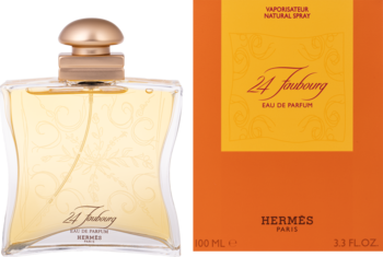 Hermès 24 Faubourg EDP, złoty flakon z tłoczeniami obok pomarańczowego pudełka. Kwiatowy, zmysłowy zapach.