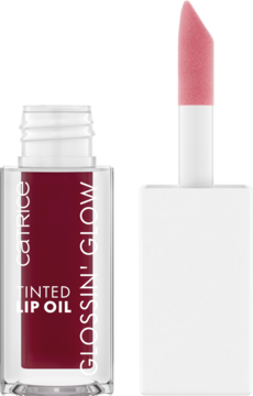 Catrice Glossin' Glow Tinted Lip Oil 070 Make A Move. Przezroczysta butelka, śliwkowy płyn, wysunięty aplikator.