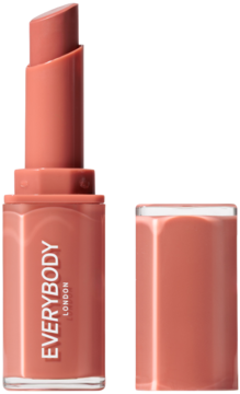 Ciepła cynamonowo-nudowa pomadka Plumping Lipstick Everybody London, otwarta, z wysuniętym sztyftem i obok odłożoną skuwką.