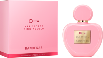 Perfumy Banderas Her Secret Pink Absolu w sercowatej, różowej butelce obok pasującego pudełka.