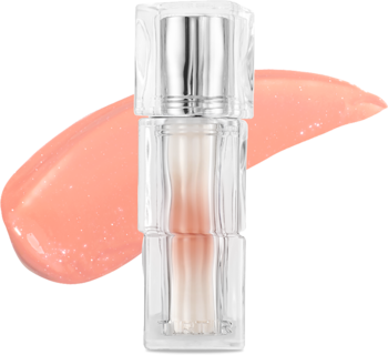 Mini tint TIRTIR Waterism Glow Tint Snowy Peach w przezroczystym opakowaniu, z połyskliwą, brzoskwiniową smugą koloru.