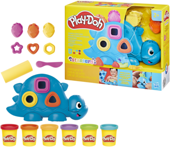 Play-Doh Dinozaur Kształty i Kolory: niebieska figurka, foremki, 5 ciastolin, akcesoria i opakowanie.