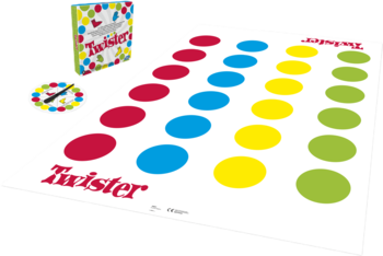 Gra Twister: rozłożona biała mata z rzędami czerwonych, niebieskich, żółtych i zielonych kół. Obok pudełko i spinner.