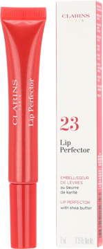 Clarins Lip Perfector nr 23 w czerwonej tubce obok białego opakowania, widok z przodu. Błyszczyk z masłem shea.